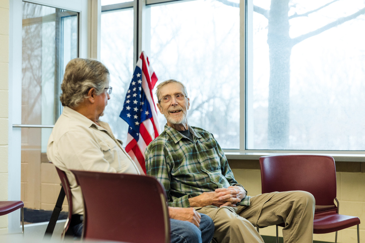 A photo of elderly veterans talking